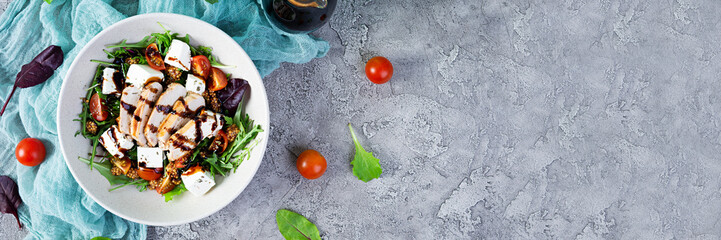 Fresh salad with chicken, tomatoes, herbs and feta cheese. Healthy food. Top view