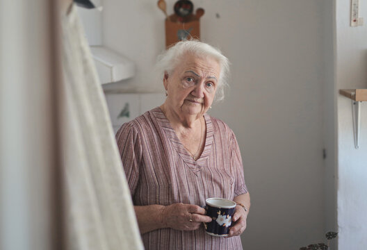 portrait of elderly lady in her kitchen