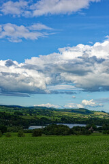 Looking down to Loch Clunie from the surrounding Hills with scattered Trees amongst the farmland of...