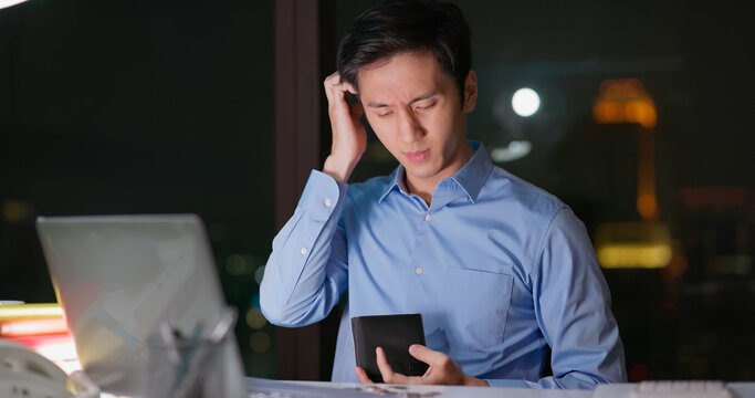 Business man counts coins - Powered by Adobe