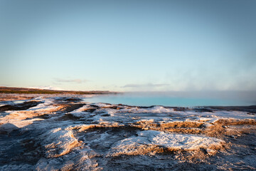 Iceland winter blue geothermal geysir hot springs in sunrise or sunset