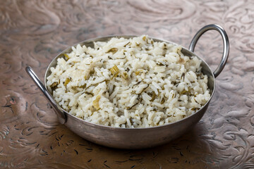 rice in bowl with herbs bachash
