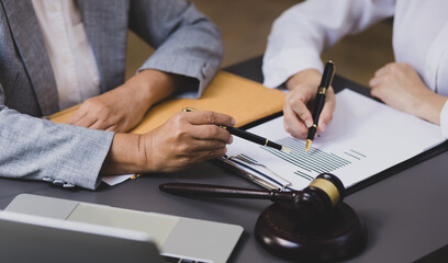 lawyer working on table office, law and justice concept, Selective focus, Law, Business people negotiating a contract, signing contract.	