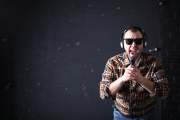 Male architect builder in a protective helmet