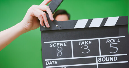 man in front green screen