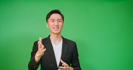 man in front green screen