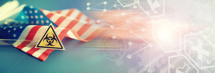 American flag, test tubes and biohazard sign. The concept of American biolabs and research centers.