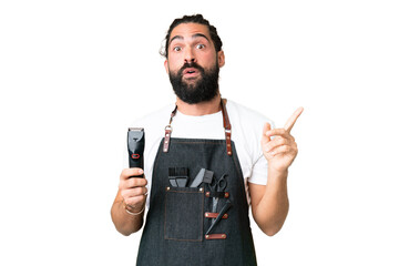 Young barber man over isolated chroma key background intending to realizes the solution while...