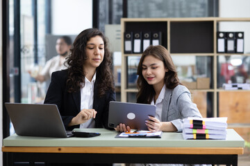 Fototapeta premium Businesswoman meetings team, Two business presentations to new projects, Consultations of business people working in meeting room, Brainstorming together to get ideas concept.