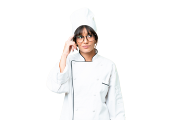 Young caucasian chef  woman over isolated chroma key background having doubts and with confuse face expression