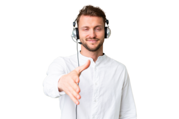 Telemarketer caucasian man working with a headset over isolated chroma key background shaking hands for closing a good deal