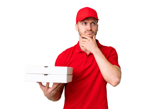 Pizza delivery man with work uniform picking up pizza boxes over isolated chroma key background having doubts