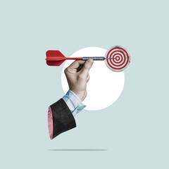 Businessman holding a dart aiming at the target - business targeting, aiming, focus concept. Art...