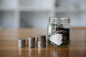 stack of silver coins, saving money for financial investment concept.
