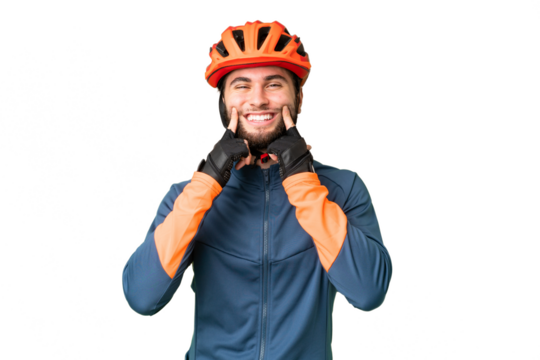 Young cyclist man over isolated chroma key background smiling with a happy and pleasant expression