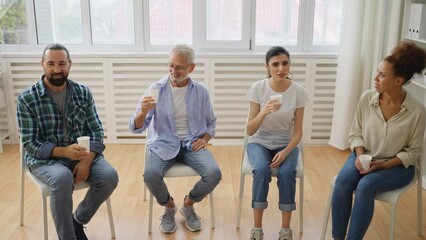Multiethnic people from support group having coffee break, casual conversation