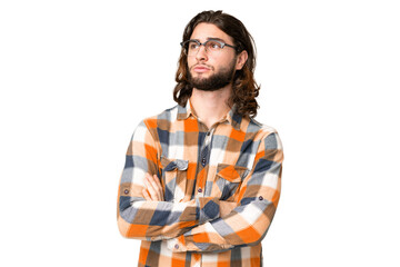 Young handsome man over isolated chroma key background looking to the side