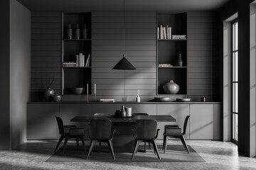 Front view on dark dining room interior with dining table