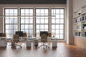 Light office interior with pc computer on desk, shelf with panoramic window