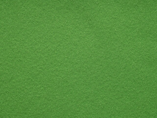 Green felt background texture. Surface of snooker or poker table. Natural felt for patchworkor or other artwork. Full frame background texture pattern of art and stationery material in bright color.