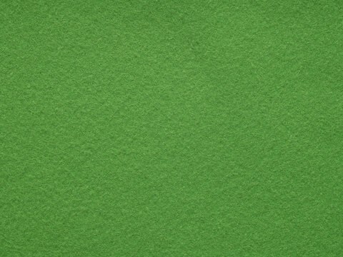 close up view of dark green felt texture Stock Photo by LightFieldStudios
