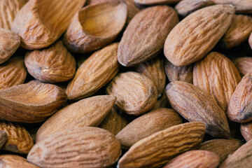 Almond nuts close. Background of almond nuts. Pile of almonds cl