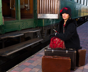 Flapper dress lady sitting on suitcase