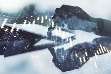 Multi exposure of abstract creative financial chart with world map and with finger presses on a digital tablet on background, research and analytics concept