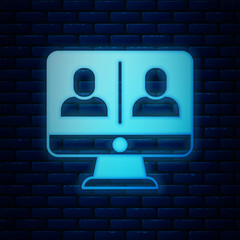 Glowing neon Video chat conference icon isolated on brick wall background. Online meeting work form home. Remote project management. Vector