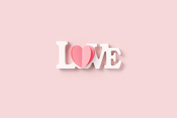 Heart and word love, St. Valentine Day, love or wedding day concept. Cut pink paper heart and white wooden text love as symbol romantic relationships, pink color background, minimal flatlay