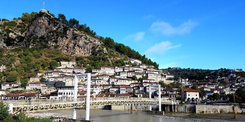 Berat is a city on the Osum River in central Albania. It is famous for the white Ottoman houses and for the castle of Berat, a huge complex on the hill where some citizens now reside. inside its walls
