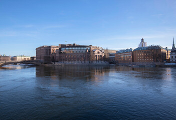 The west side of the parliament house, royal castle and the old town Gamla Stan a sunny snowy...