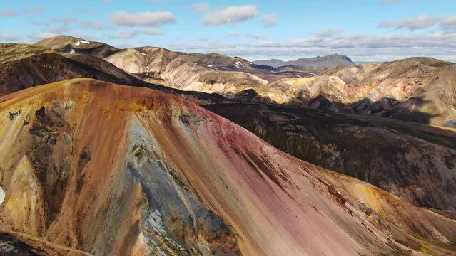 landmannalaugar brennisteinsalda mountain aerial view drone flying orbit sunny summer day,iceland colourful mountain landscape panorama