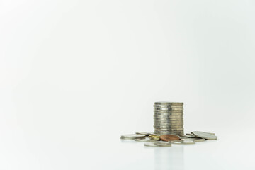 Close-up shot of a stack of coins with white background, concept of saving money and investing, copy space, background