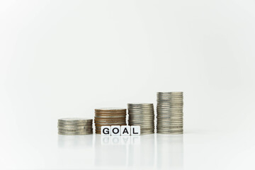 stack of coins with good word, money saving concept, financial and business growth concept, white background, copy space.