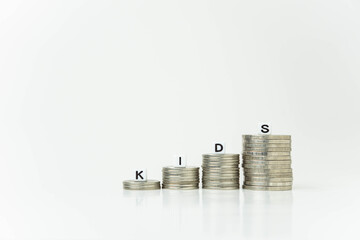 Close-up shot of a stack of coins with white background, concept of saving money and investing,...