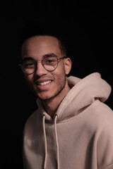 Fototapeta premium Handsome african american man wearing casual clothes and glasses happy face smiling looking at the camera. positive person. 