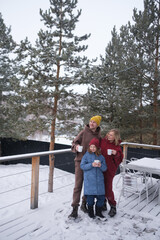 Fototapeta na wymiar Portrait of happy family outdoors on winter day