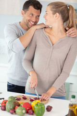 perfect couple looking each other and enjoyment togetherness cooking