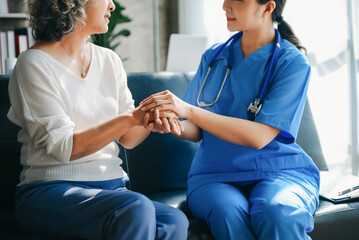 Obraz premium medical doctor holing patient's hands and comforting her.Kind doctor giving real support for patient.