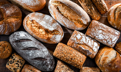 Assorted bakery products including loafs of bread and rolls