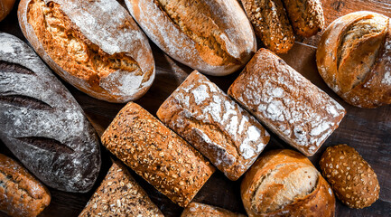 Assorted bakery products including loafs of bread and rolls