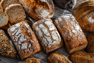 Assorted bakery products including loafs of bread and rolls