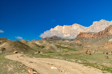 A road in the mountains. The road to the Bezengi gorge. Nature of Russia Caucasus. Off-road in the mountains.