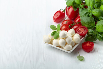 Mozzarella cheese with basil and tomatoes.