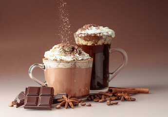 Hot chocolate and coffee with whipped cream sprinkled with chocolate crumbs.