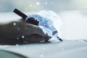 Digital America map and man hand writing in diary on background, global technology concept. Multiexposure