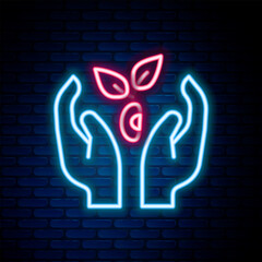Glowing neon line Plant in hand of environmental protection icon isolated on brick wall background. Seed and seedling. Planting sapling. Ecology concept. Colorful outline concept. Vector