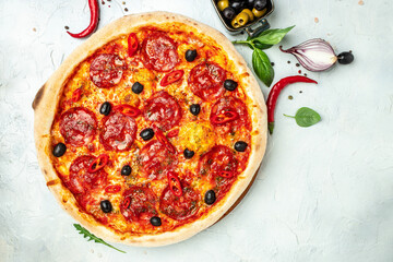 spicy pepperoni pizza, Tomato sauce, pepper, Italian pizza on a light background. Restaurant menu, dieting, cookbook recipe top view