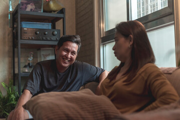 An asian woman is not amused at her husband's inappropriate or misogynistic jokes. Martial problems...